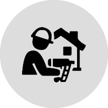 icon showing a construction worker working on a home